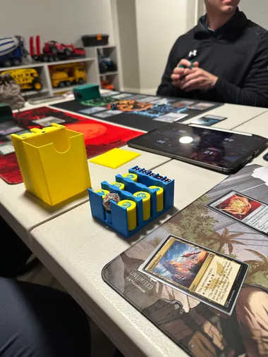The Commander Cube on the table during a real game night