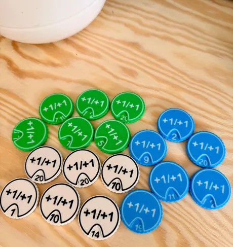 +1/+1 dial expansion set in green, blue, and white