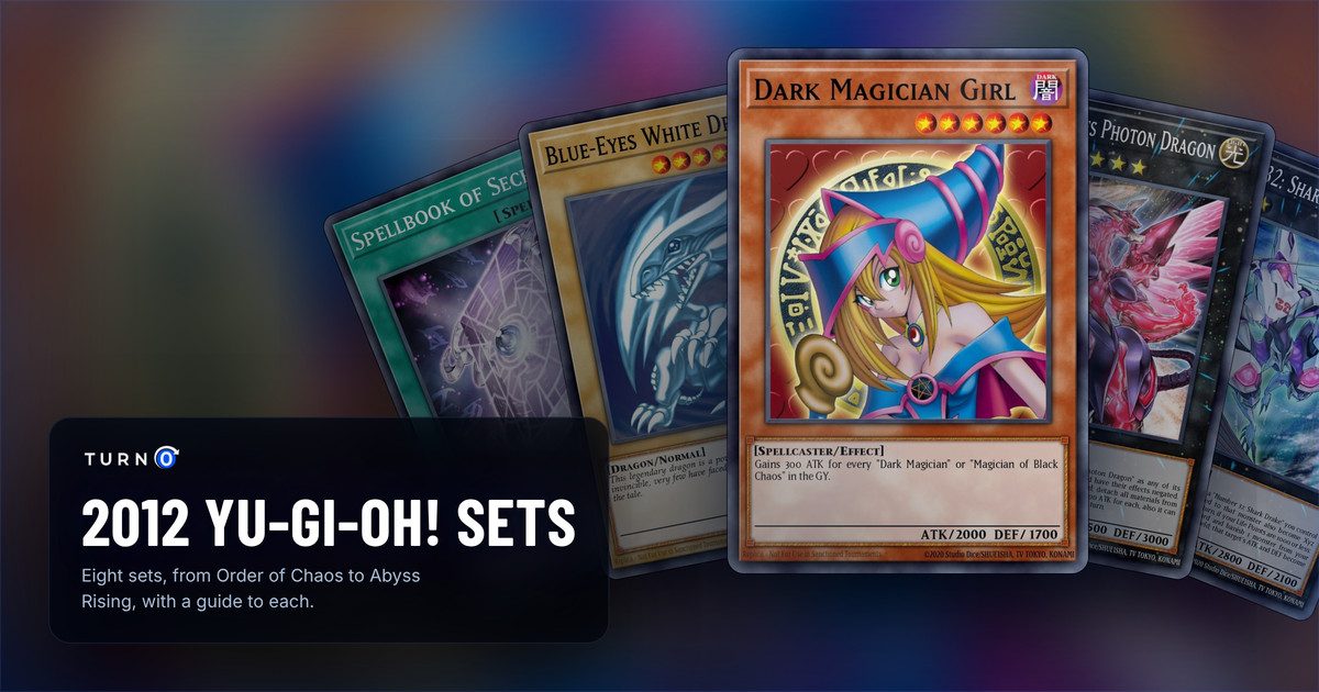 The chase cards of five 2012 Yu-Gi-Oh! sets fanned out: Spellbook of Secrets, Blue-Eyes White Dragon, Dark Magician Girl in front, Neo Galaxy-Eyes Photon Dragon and Number C32: Shark Drake Veiss.